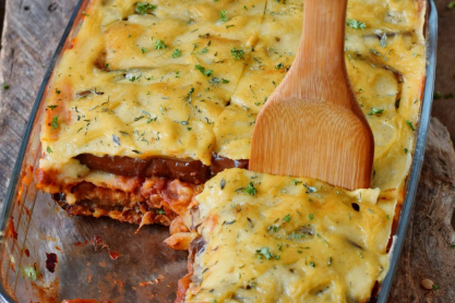 vegan-moussaka-and-wooden-spatula-in-a-glass-baking-dish.jpg